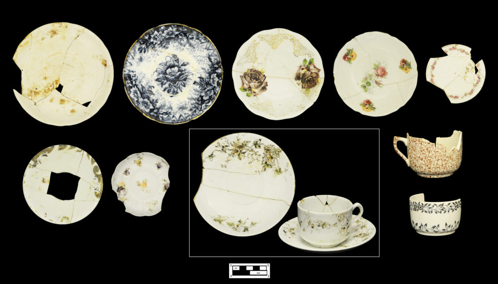 Sampling of decorated tea and tableware: (Top row, left to right) Porcelain saucer with faded overglaze painted pattern (4A-C-0012); flow blue printed saucer with gilded rim (4A-C-0007); decal-decorated semi-porcelain saucer (4A-C-0003); decal-decorated porcelain fruit saucer (4A-C-0002); decal-decorated porcelain individual butter (4A-C-0031). (Bottom row, left to right) Porcelain saucer with faded over glaze painted design (Cat # 4.24.100); porcelain demitasse saucer decorated in hand-painted enamels (4A-C-0020); matching cup and two saucers decal-decorated porcelain (4A-C-0018; 4A-C-0075; 4A-C-0017); whiteware teacup with printed brown chintz pattern (4A-C-0107); whiteware teacup with black printed floral decoration (4A-C-0105).