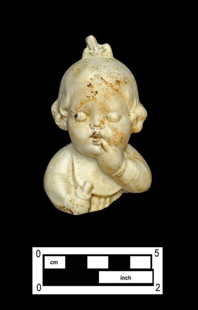 One of two matching bisque porcelain toddler girl figurines (4A-C-0033).