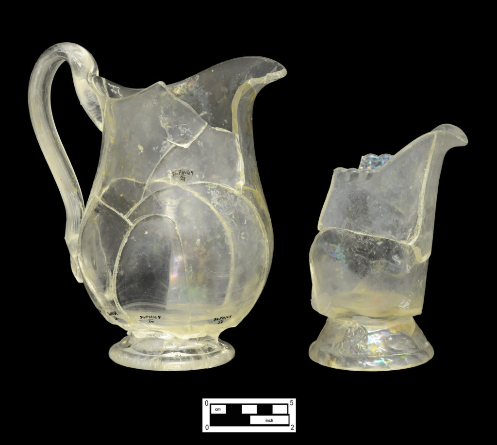 Large footed pitcher (4A-G-282) and pressed creamer with Recumbent Lion motif on flared foot (4A-G-168).