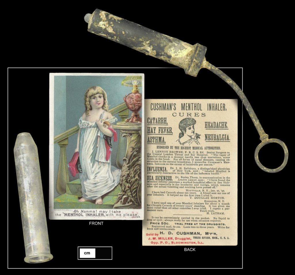 Other Medical Devices from 1018 Palmer Street: White metal syringe (top right, 4.24.509) and Cushman’s Menthol Inhaler tube (bottom left, shown with trade card, 4.22.21)