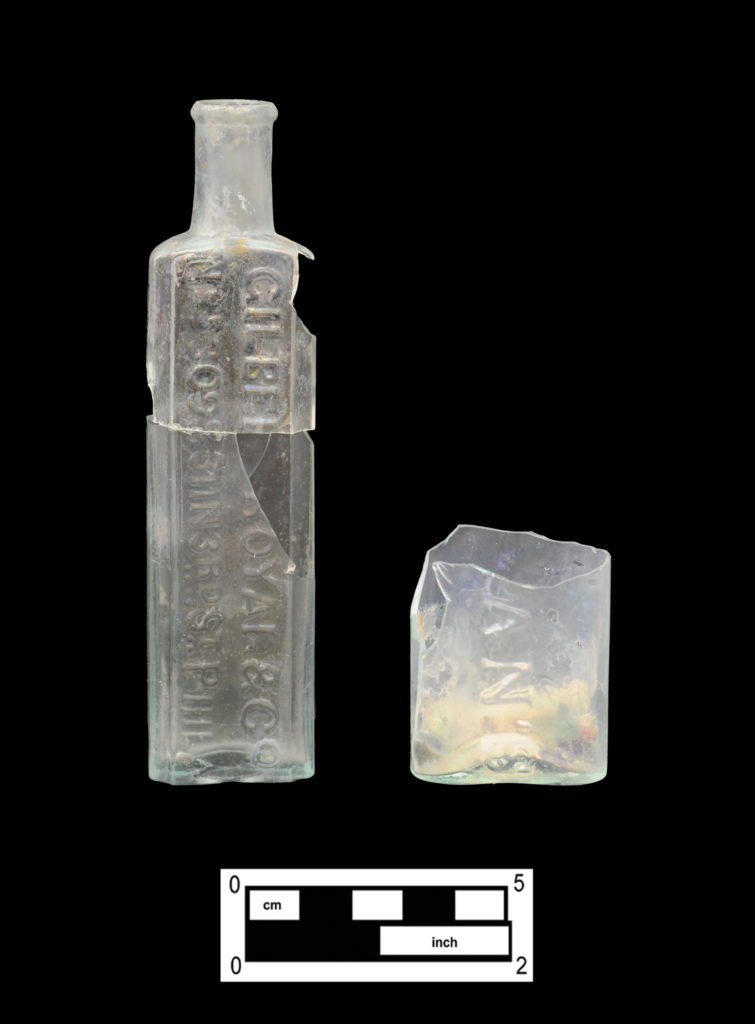 1018 Palmer Street Druggist Bottles: Gilbert, Royal & Co. bottle (left, 4A-G-0170) and base/lower section of a Vaughan’s bottle (right, 4A-G-0347)