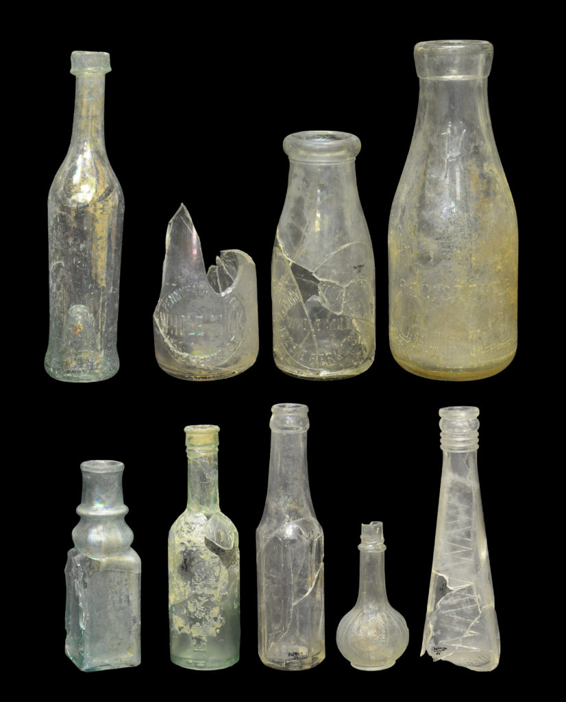 Food bottles from the Cramp-Bumm assemblage include, top row, left to right: free-blown vegetable oil/salad dressing bottle (4A-G-0076), two Pennypacker & Co. milk bottles (4A-G-0136, left, and cat. 24.350, right), and a Harbison’s Dairy milk bottle (4A-G-0014), and bottom row, left to right: gothic-style pickle/preserved food bottle (4A-G-0371), Lea & Perrins Worcestershire sauce bottle (4A-G-0289), crown finish sauce bottle (4A-G-0125), Joseph Campbell Preserve Co. sauce bottle (4A-G-0011), and Waw-Waw pepper sauce bottle (cat. 24.352)